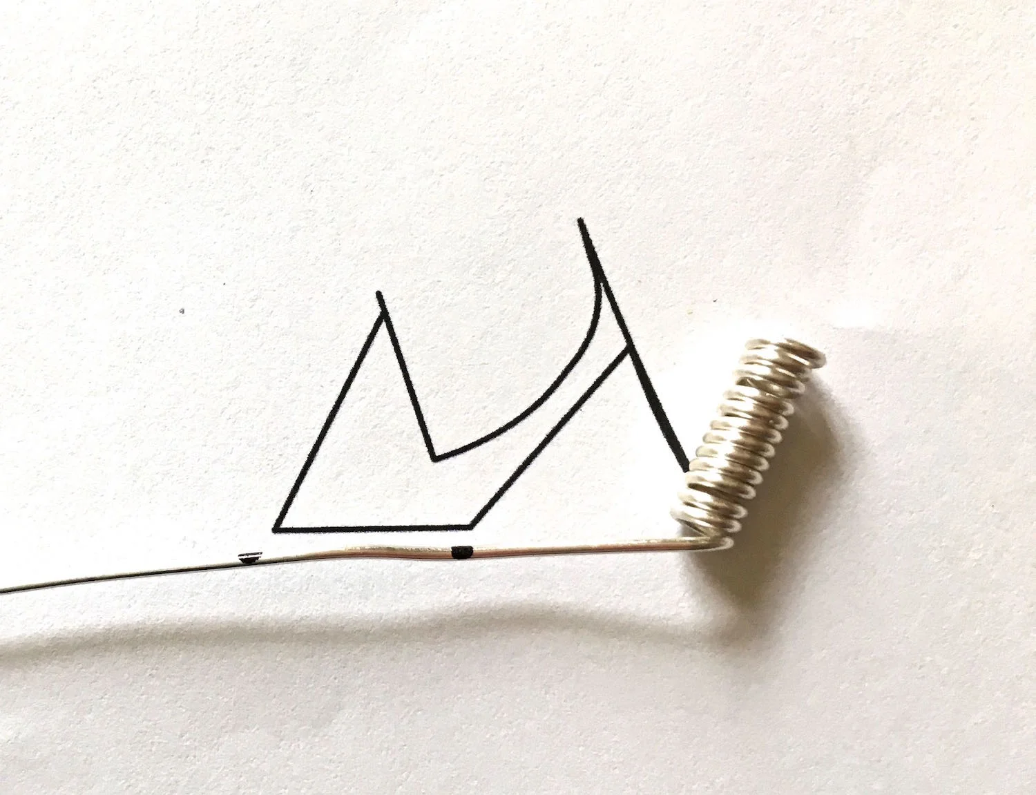 step 2 - Align the wire with the template and mark the second bend. Mark the wire with a Sharpie. Remove the marks with alcohol when the project is finished.