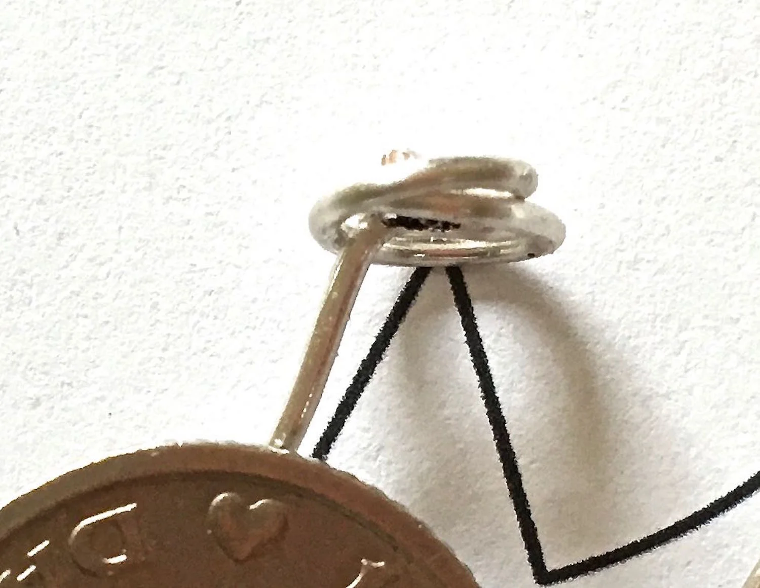 step 6 - Use needle nose pliers to curl the wire into a round seat.