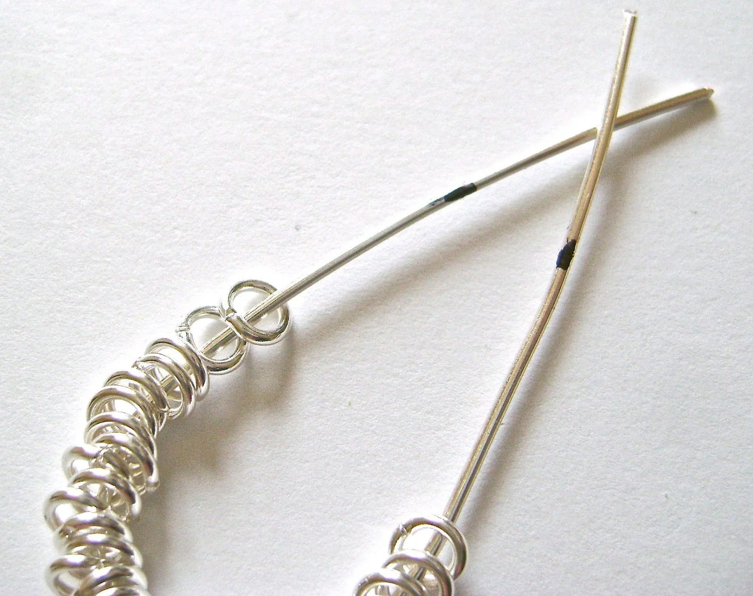 step 2 - Slip 30 jump rings onto the wire. 