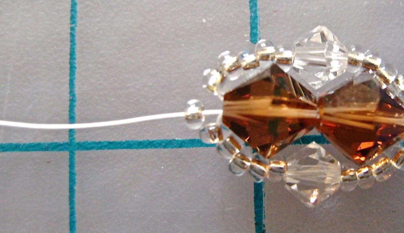 step 8 - To finish this side of the bracelet, string on one more seed bead.