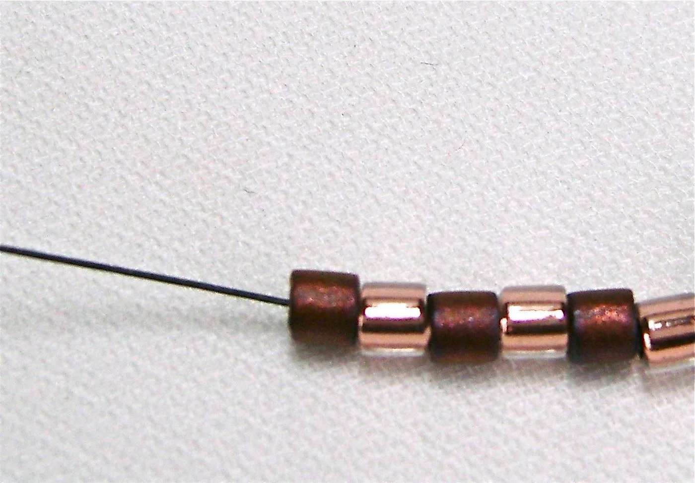step 2 - String on six seed beads. 