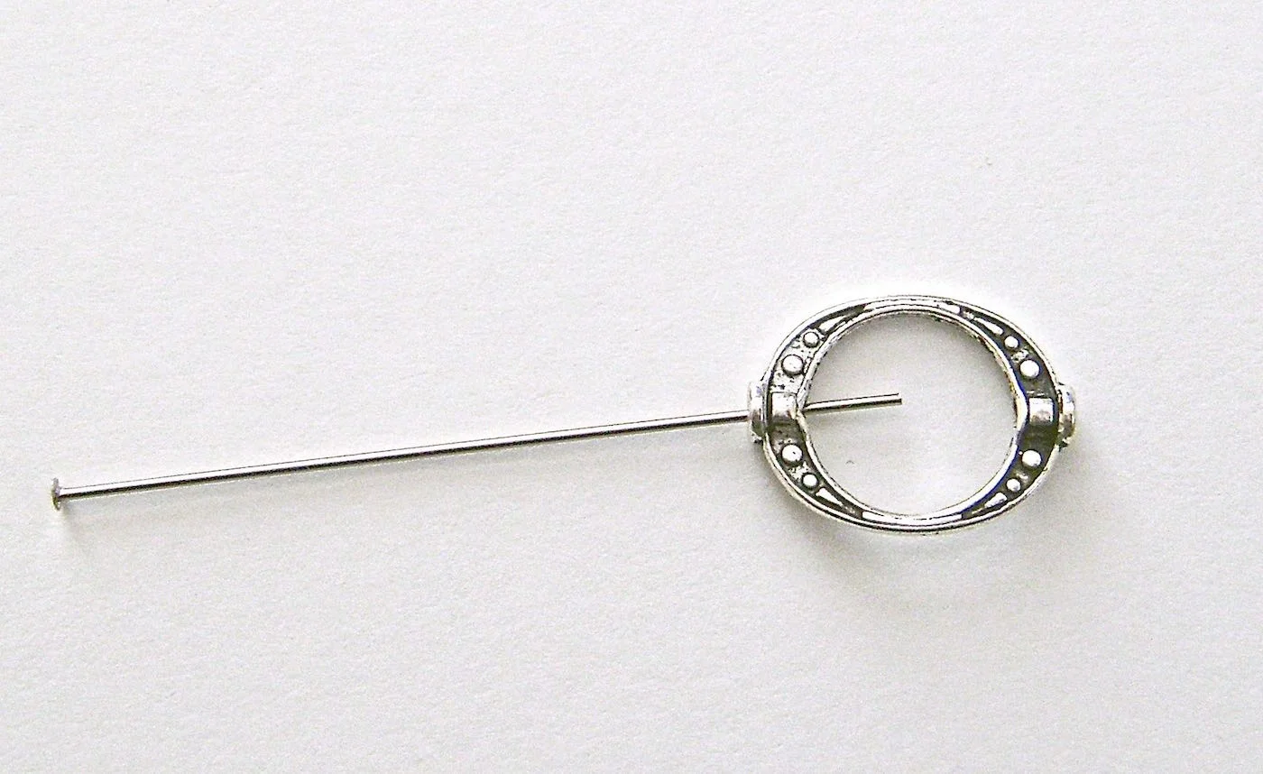 step 1 - Insert the head pin wire or other wire into the opening in the silver casing.