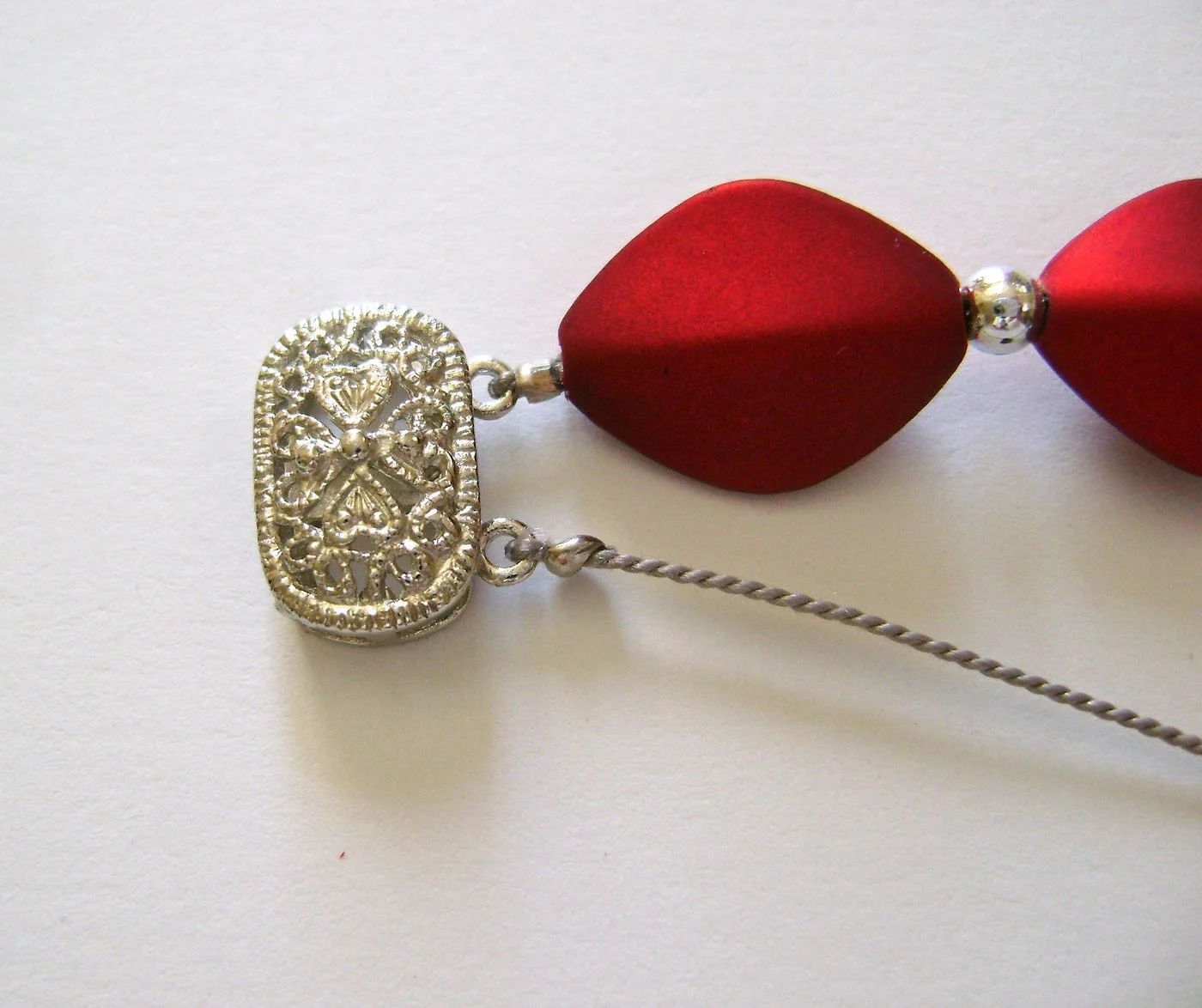 step 7 - Create the second row of beading by attaching cord to the bottom clasp loop and secure with a crimp bead just as you did with the top row.