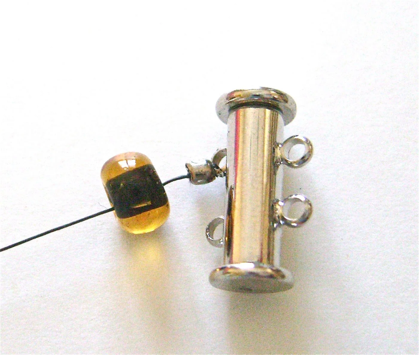 step 2 - Attach a 6mm round bead with a hole large enough to slip over the crimp bead.