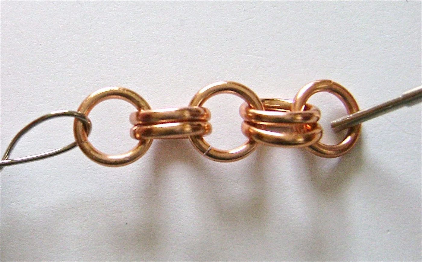 step 1 - Create a simple chain to fit your wrist by linking double rings to a single ring until you have the length you need. Be sure to figure in about 1.50” for the clasp.