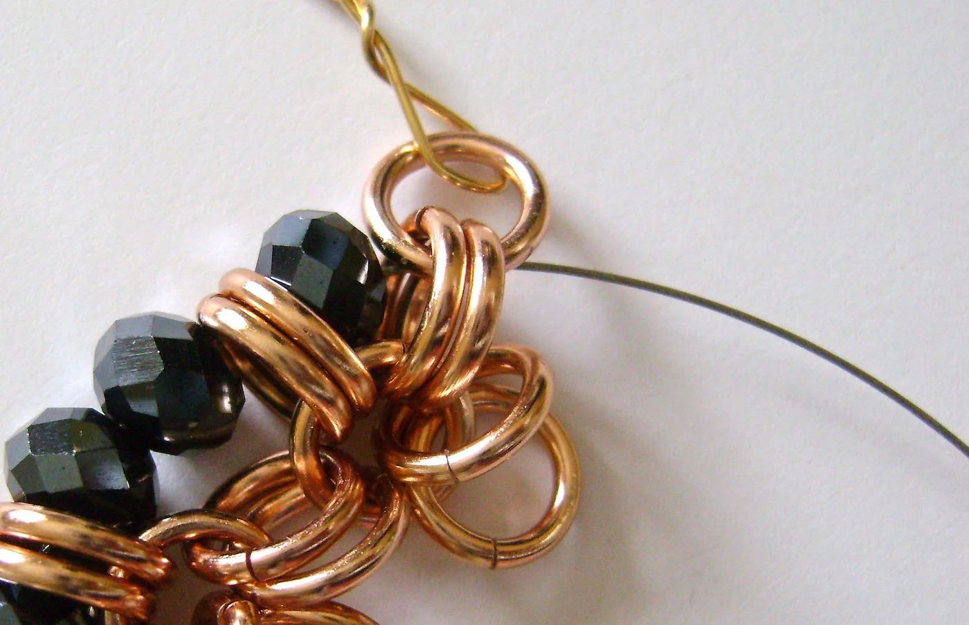 step 4 - Add two beads and pass through the next two rings.