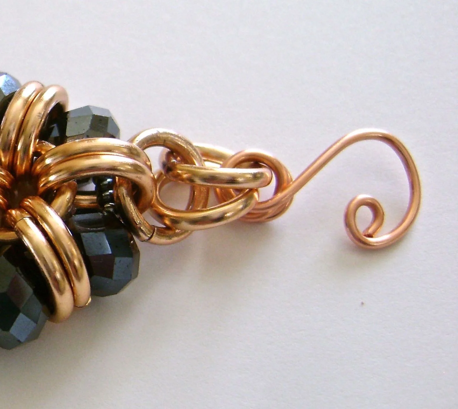 step 9 - This is a seven inch bracelet. If you need a larger or smaller one, adjust the following measurements. From the center of the bracelet, mark the cord at 3.25” with a piece of tape. Wrap the tape around both cord pieces.