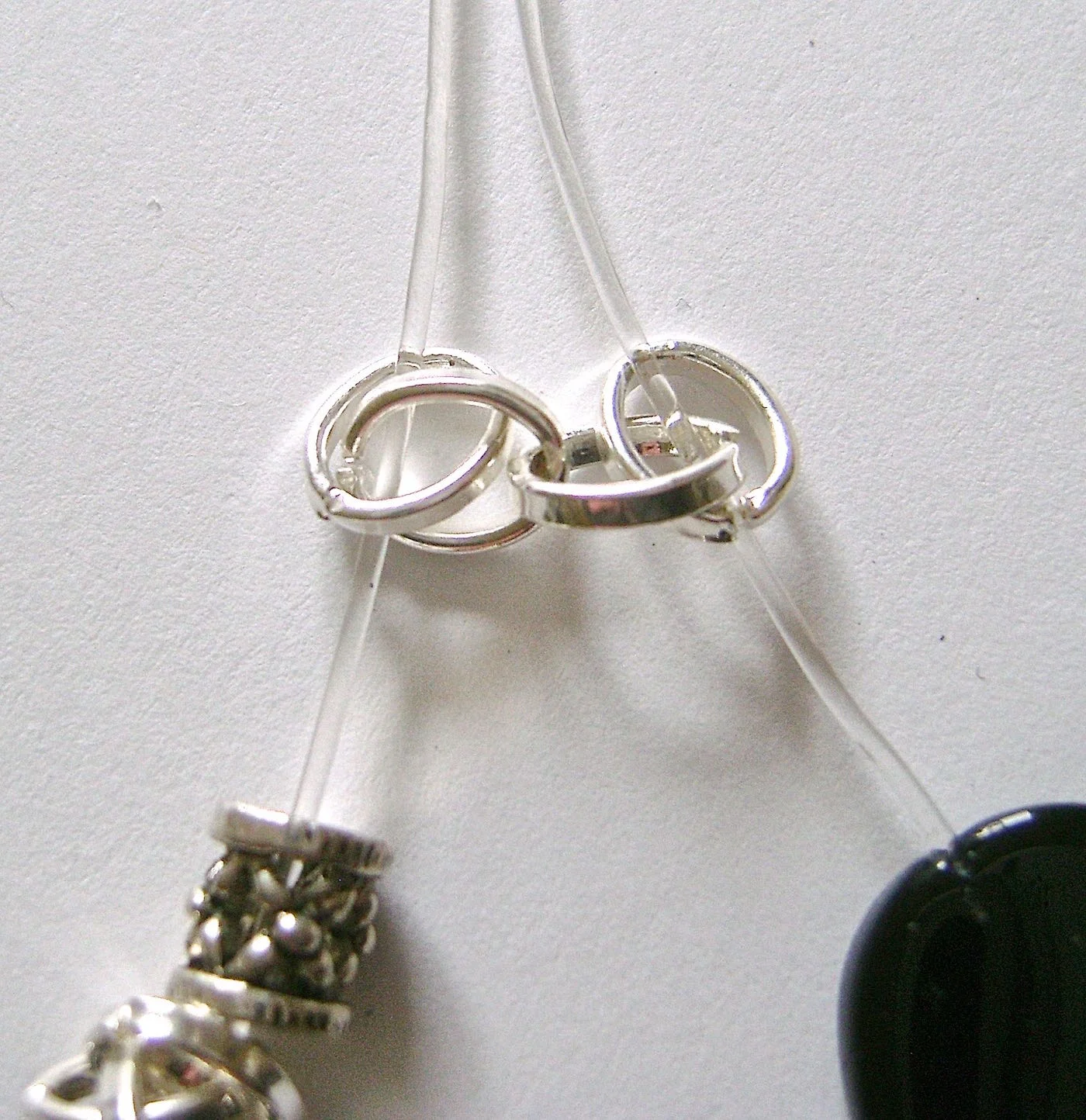 step 6 - Pass the cord through the two empty links of the first chain piece in step three.