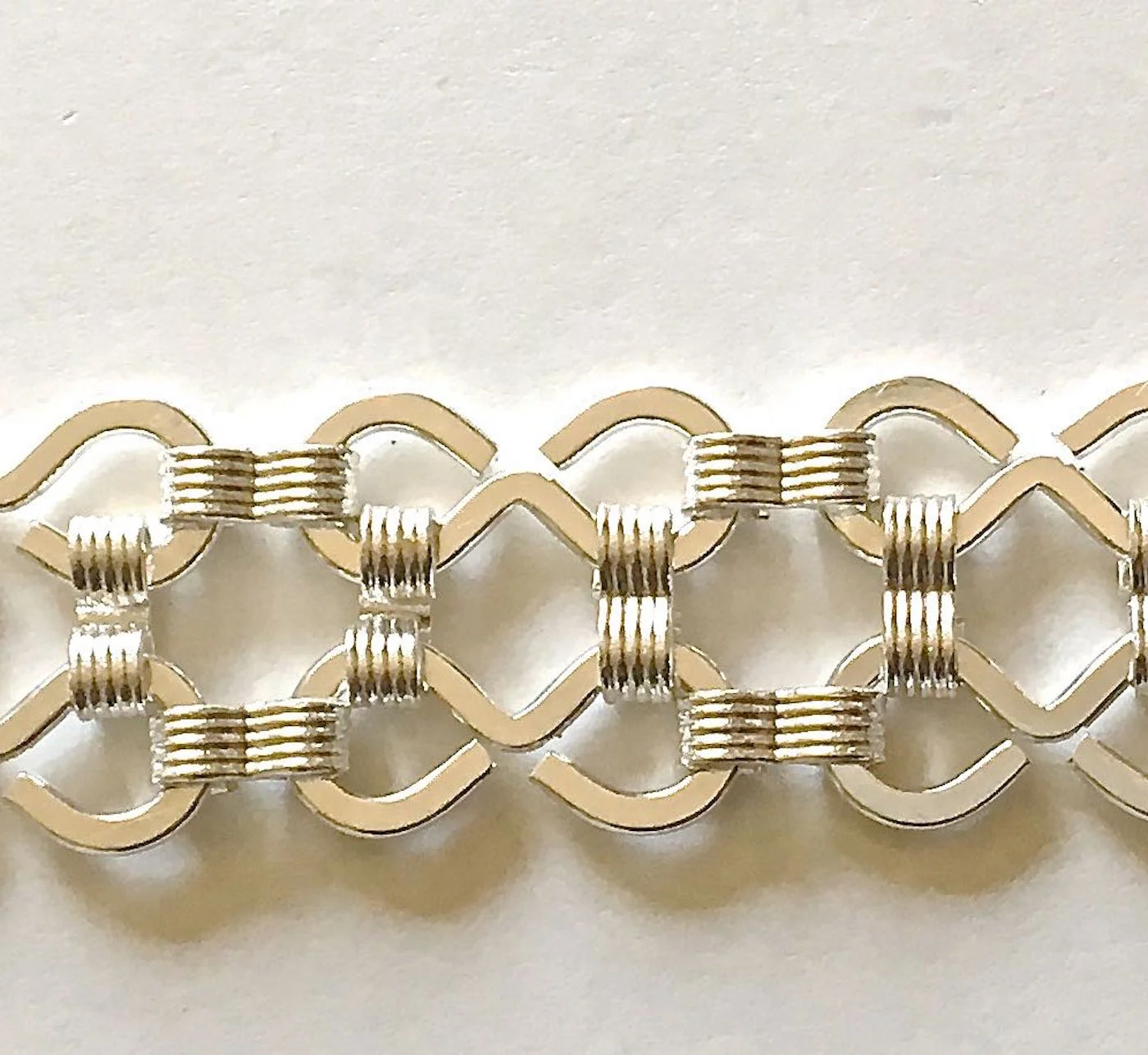 step 3 - Attach one strand to the other by joining them vertically with the links.