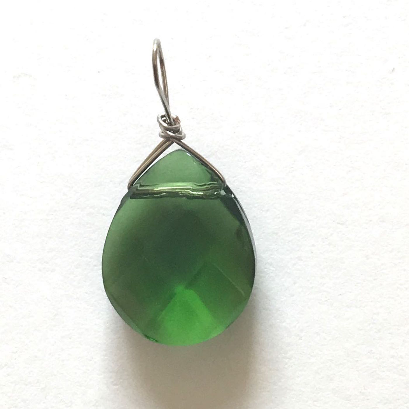 step 10 - Cut off the excess wire. With needle nose pliers, smooth the cut end of the wire to blend into the wrap. Create 11 wrapped beads this way.