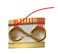 step 10 - After the last wrap, bring the wire to the back of the bracelet and insert it into a few of the wraps. Pull snugly and snip off the excess. Use needle nose pliers to smooth the protruding wire end if needed.