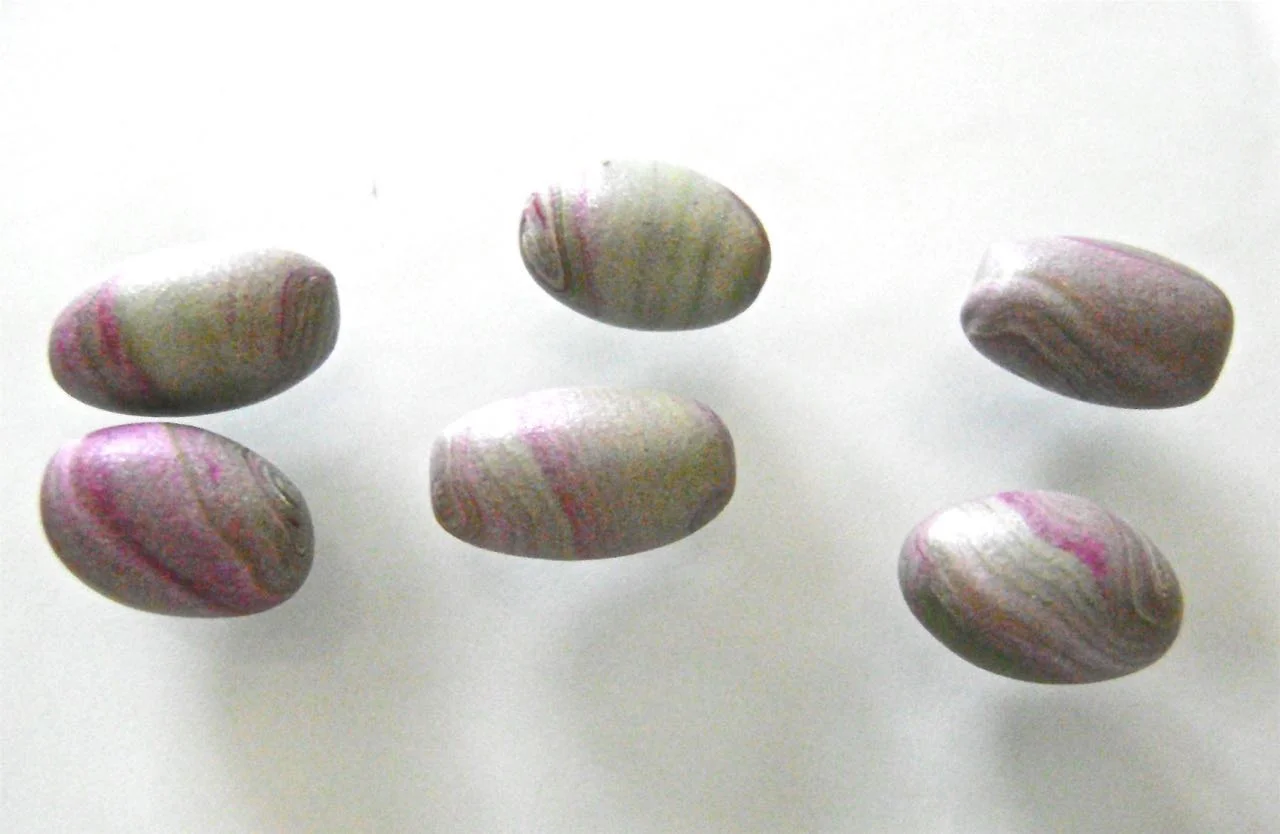 step 4 - Roll the pieces in the palm of your hand to shape the oval beads.