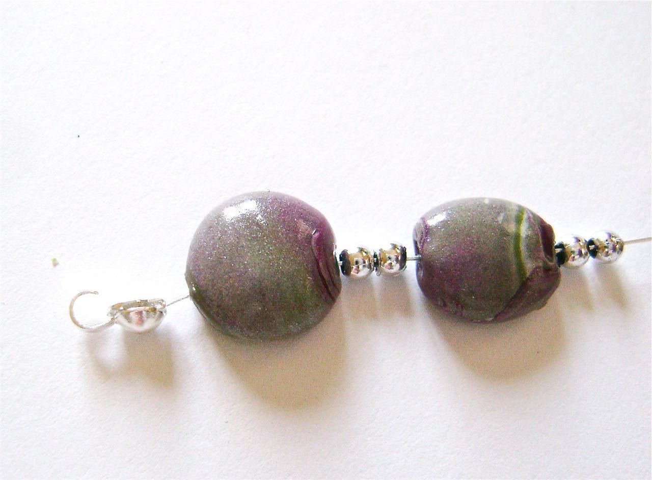 step 14 - Add a clam shell to each end of the beading wire. If you’re unsure how to attach them see Jewelry Making Techniques and Tools. 