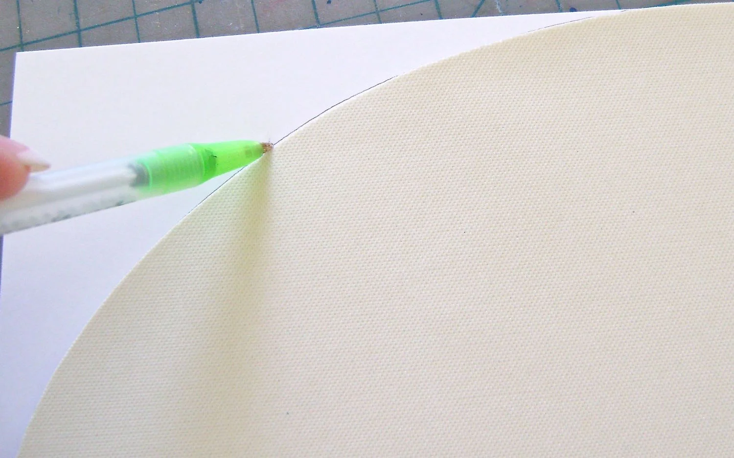 step 6 - Place the cut mat on pieced-together card stock. Trace the curved edges of the mat to create a template.