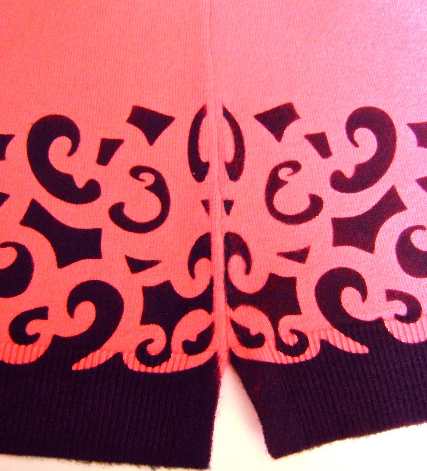 step 9 - If the painted design did not reach far enough to the sides of the sweater, position a portion of the stencil over the area to fill it in. As an option, you can also stretch the page before printing it so the stencil is closer to the width you need. If you find less than perfectly crisp lines on some of the painted areas, touch them up using a fine paint brush. 