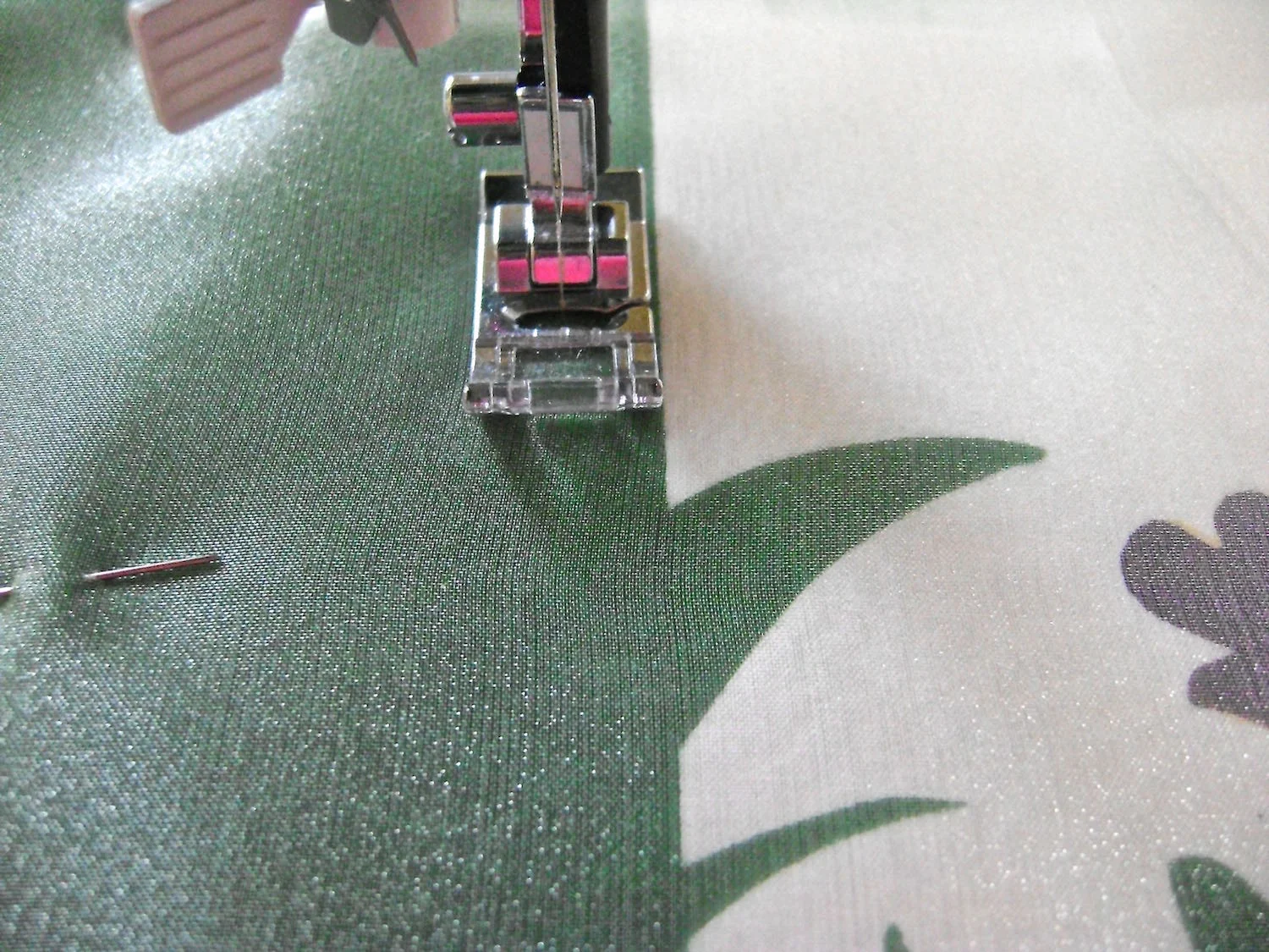step 11 - Sew the organza to the pillow front by stitching .25” from the vertical green edge.