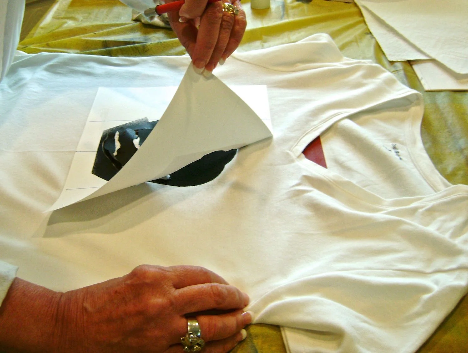 step 13 - When paint is completely dry, carefully remove the stencil. Important - Don’t forget to set the Elvis image with an iron 24 hours after applying the paint. See instructions on the paint container.