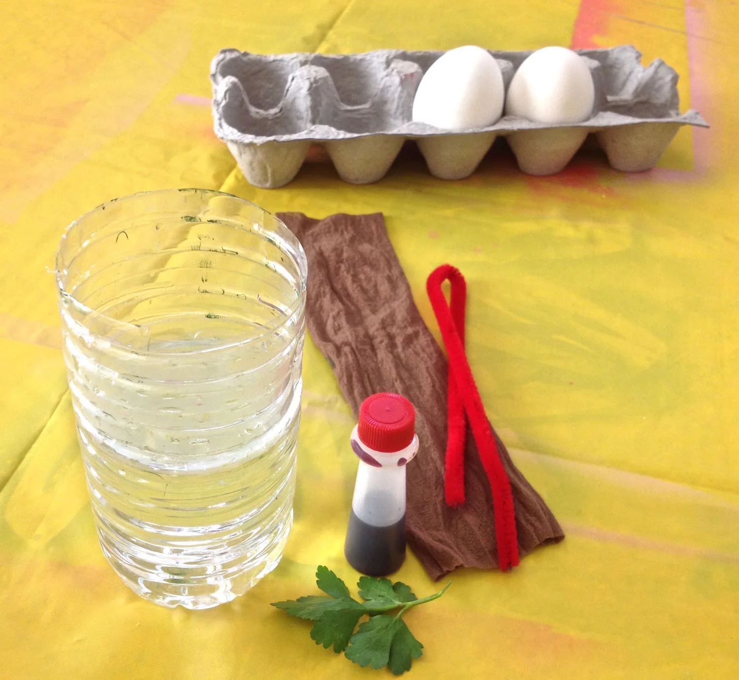 DYING EGGS Knee Highs, Water Bottles and Pipe Cleaners One very convenient way to decorate eggs with food color is to dunk them. I found some easy tools to use that keep your hands relatively dye-free and require little clean up.
