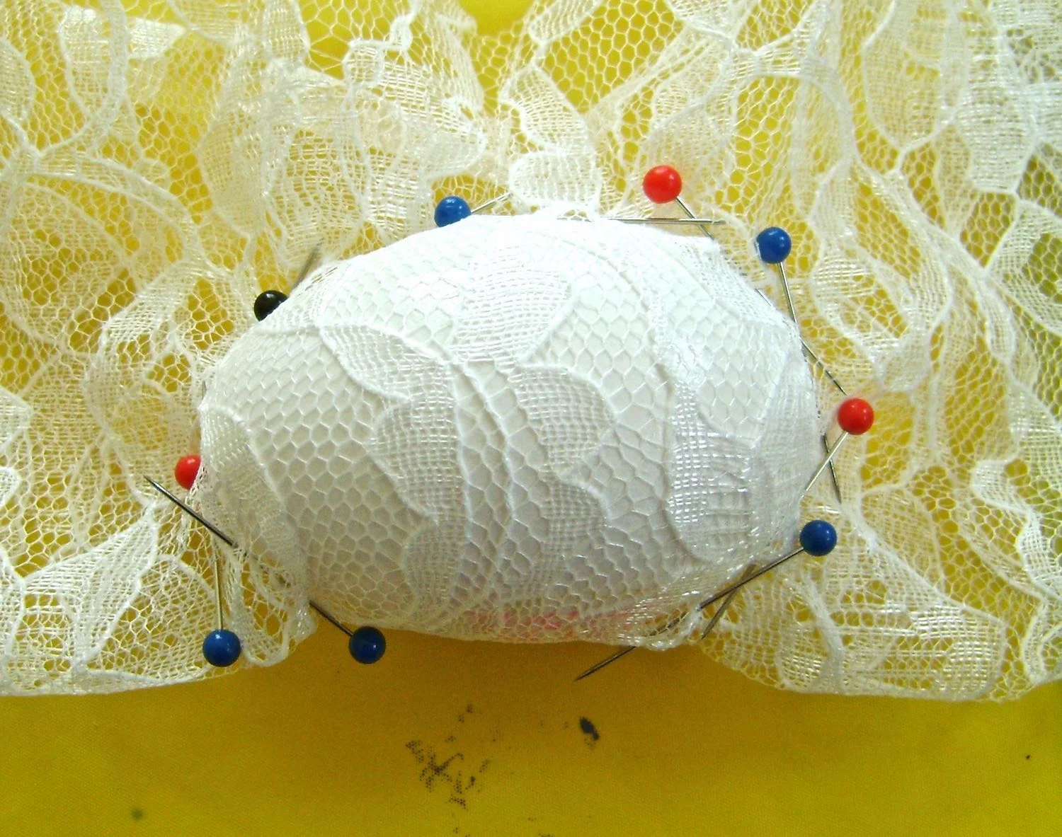 PAINTING EGGS Ideas abound when it comes to hand painting eggs. You don’t have to be an artist to create your own interesting collection. step 6A - Wrap an egg in a square of lace fabric. Pull the fabric snug and custom fit it with pins. 