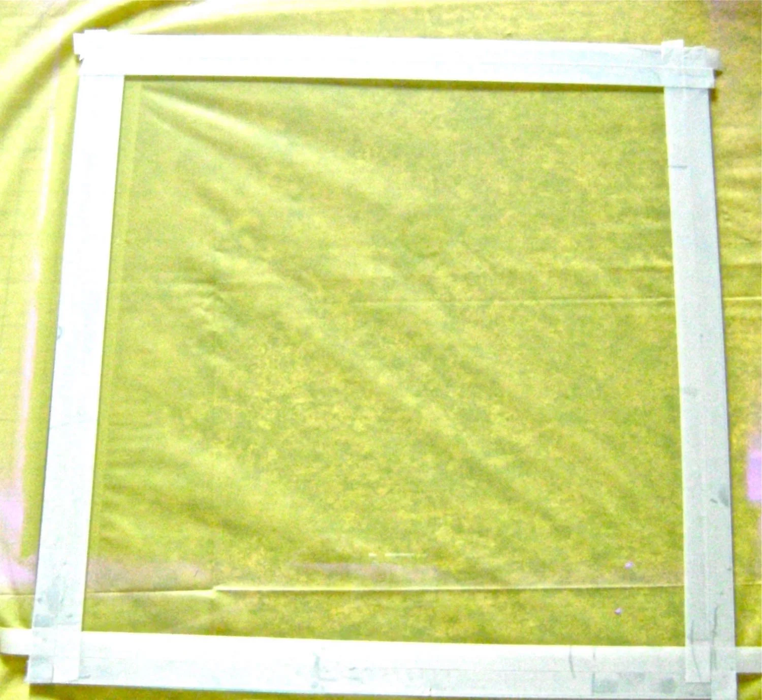 step 5 - Place a strip of half-inch masking tape along the edges of the glass on all four sides, aligning the edge of the tape with the outer edge of the glass.