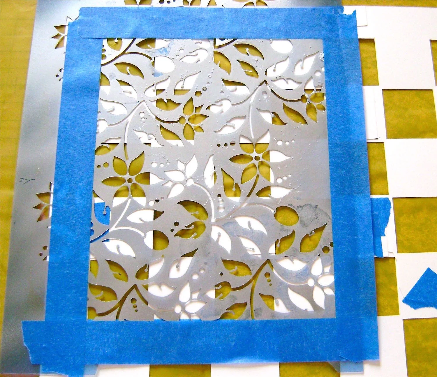  step 10 - Spray the leaf stencil with adhesive and position it on top of the board template. The stencil is not large enough to cover the entire board so it will have to be worked in sections. 