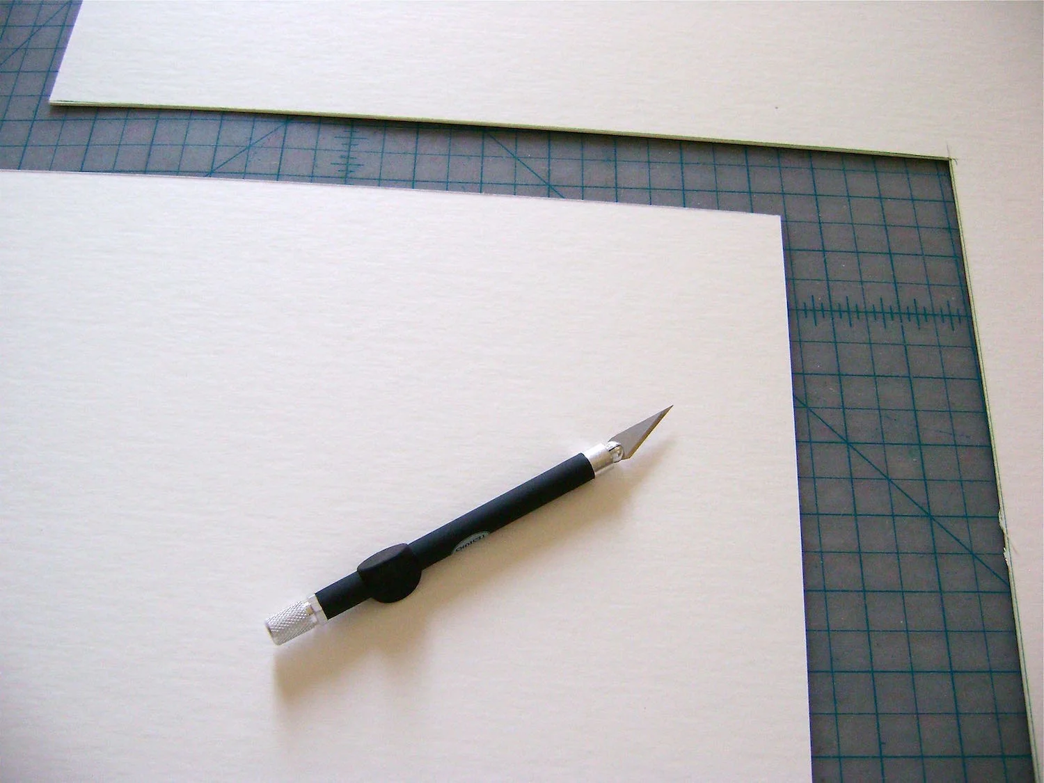 step 15 - Cut a piece of mat board to measure 14 x 14.
