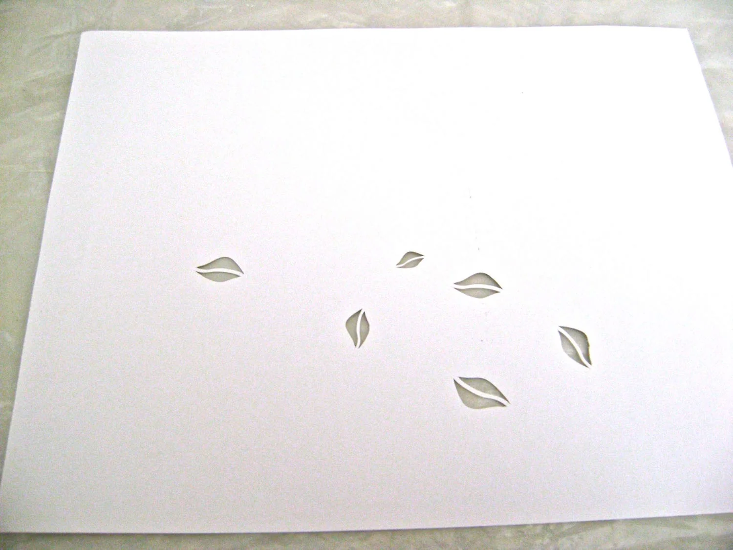 step 2 - Download and print out the leaf stencil on a label sheet. Cut out the stencil.