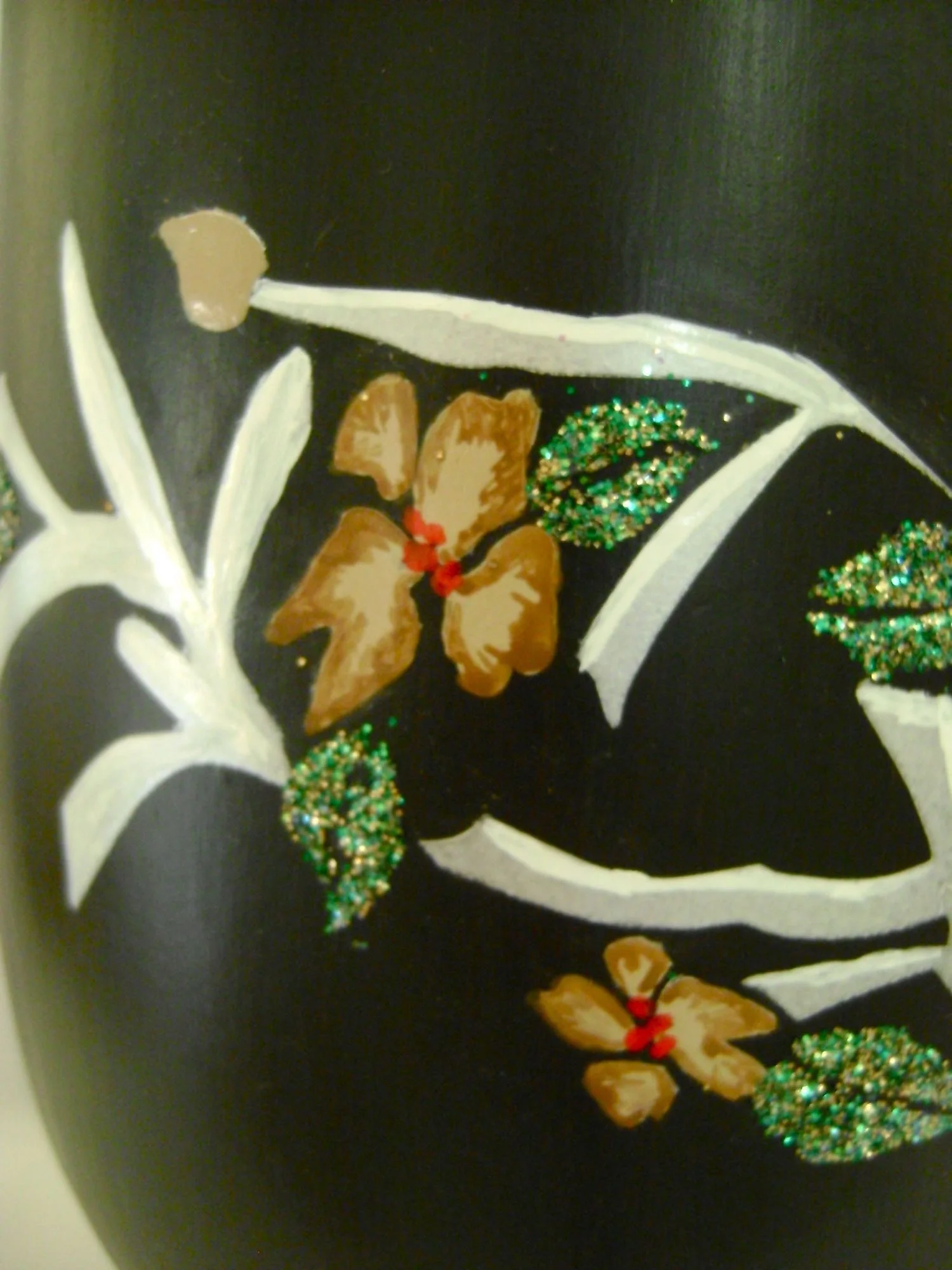 step 15 - Remove the stencil and sprinkle glitter on the coated areas. Shake off excess. Drag a toothpick through the center of the leaves to better define them. Wait 24 hours for the coating to set, then clean the entire surface with a large, dry, soft brush to remove excess glitter. Apply DullCote Lacquer if desired to protect the paint finish.