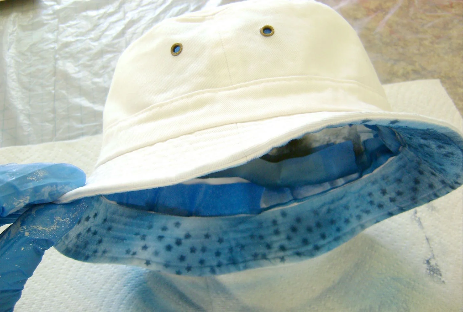step 8 - When the brim paint is dry, turn the hat right side out. Do not remove the masking.