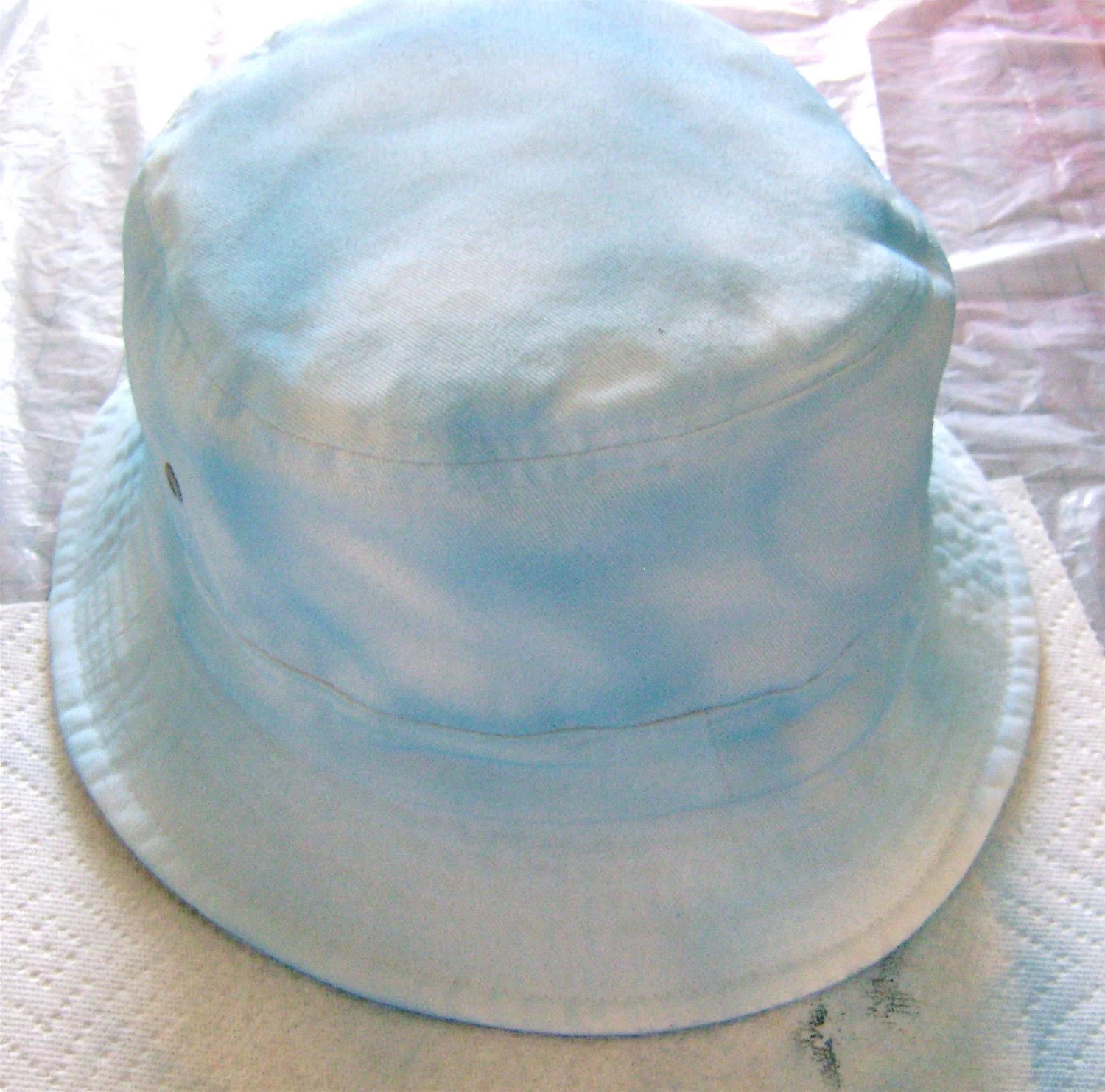 step 9 - Paint the exterior of the hat with light blue paint in random patterns.