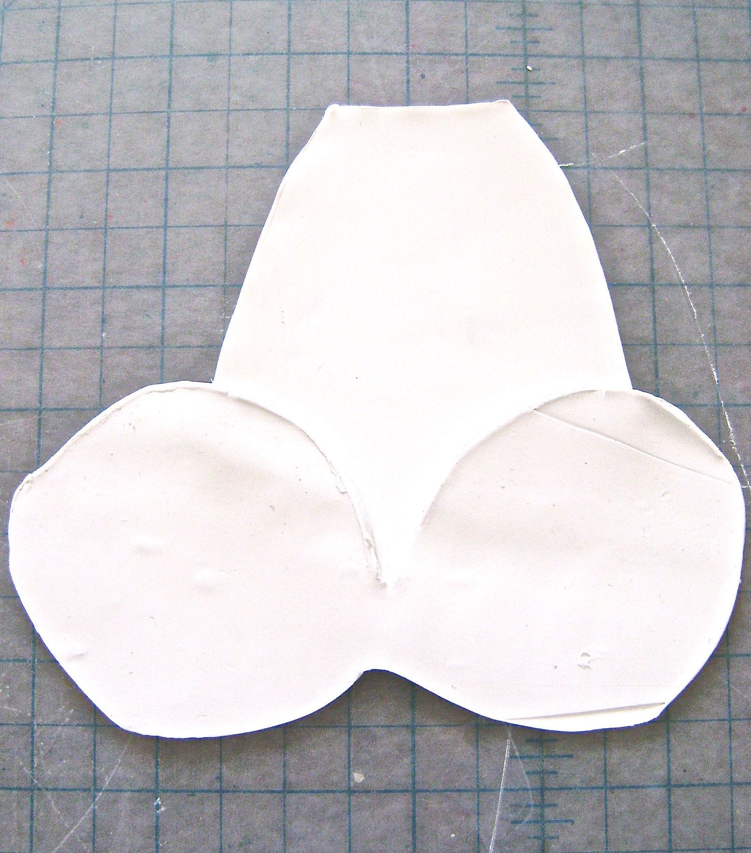 step 4 - Overlap the clay feet onto the clay body.