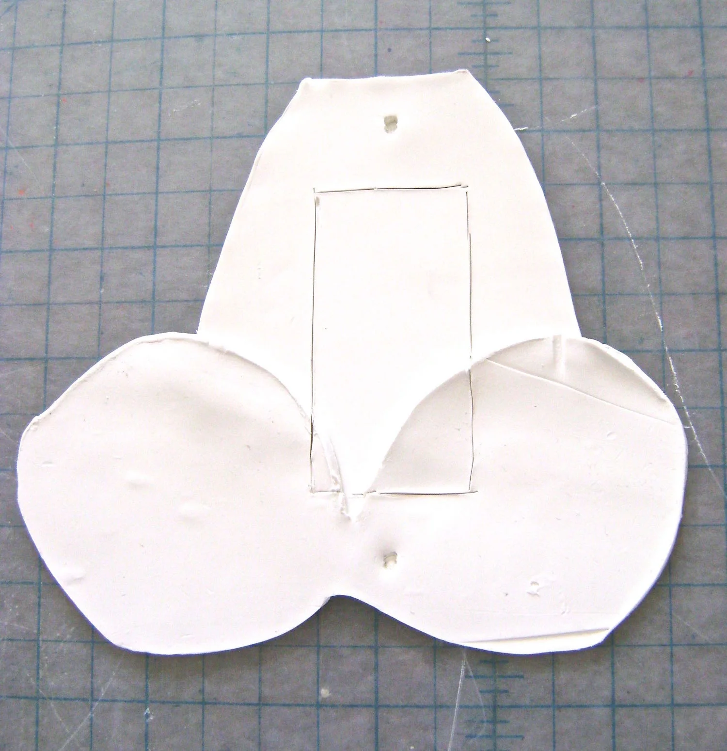 step 6 - Mark the opening in the plate with a plastic knife. Mark the openings for the screws with toothpicks.