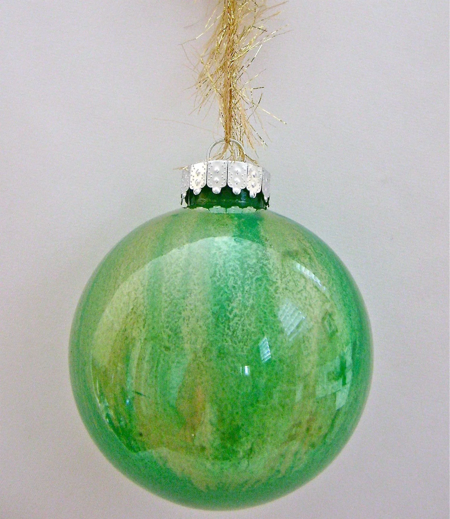 Green Ornament Apply equal portions of green followed by gold paint.
