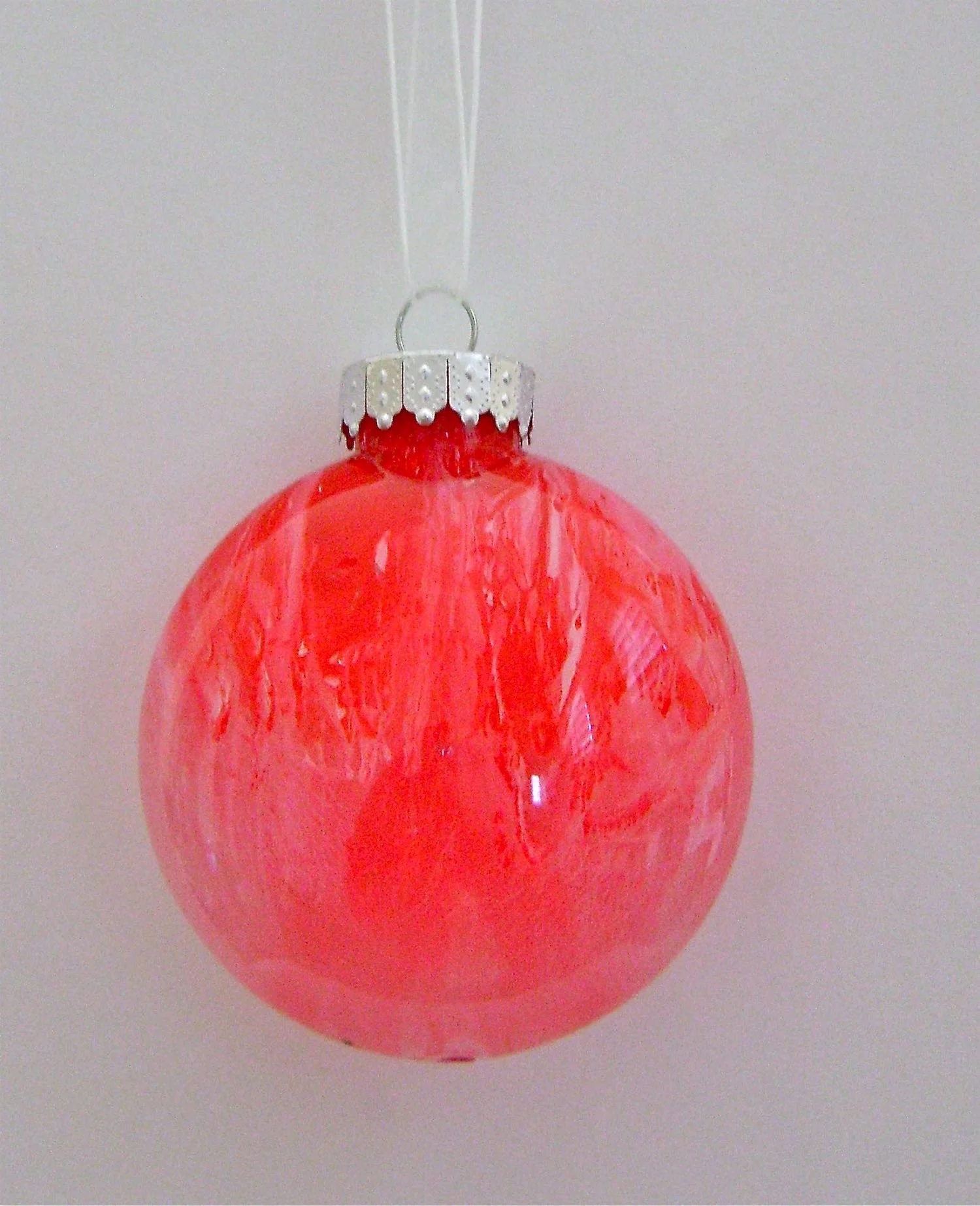 Red Ornament Apply red paint. Allow the red paint to dry almost completely. Apply white paint.
