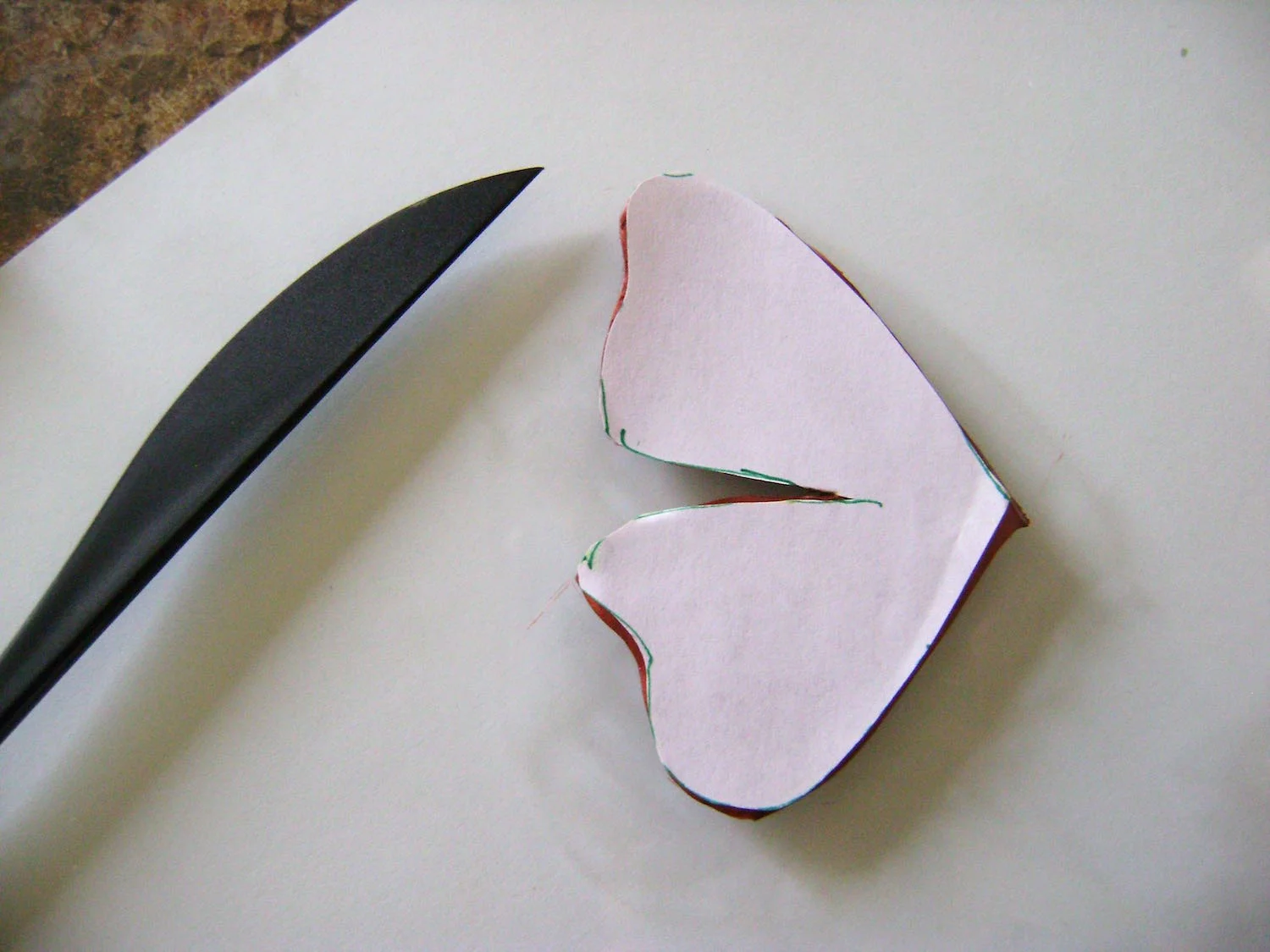 step 5 - Place the template on the clay. Use a clay-cutting tool to cut the shape. 