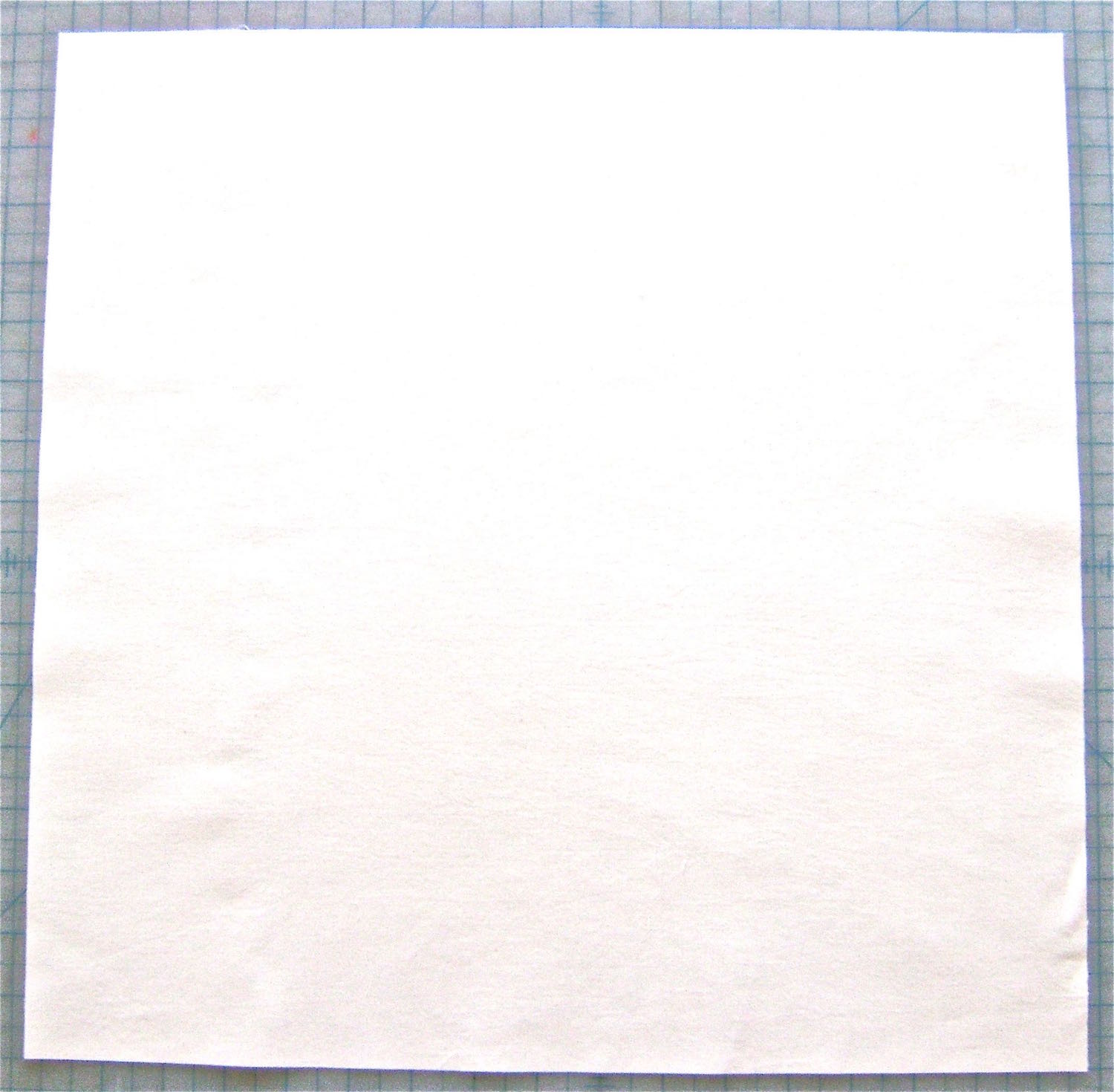step 1 - Cut the peach fabric into a 17” square. Iron fusible interfacing on the wrong side.
