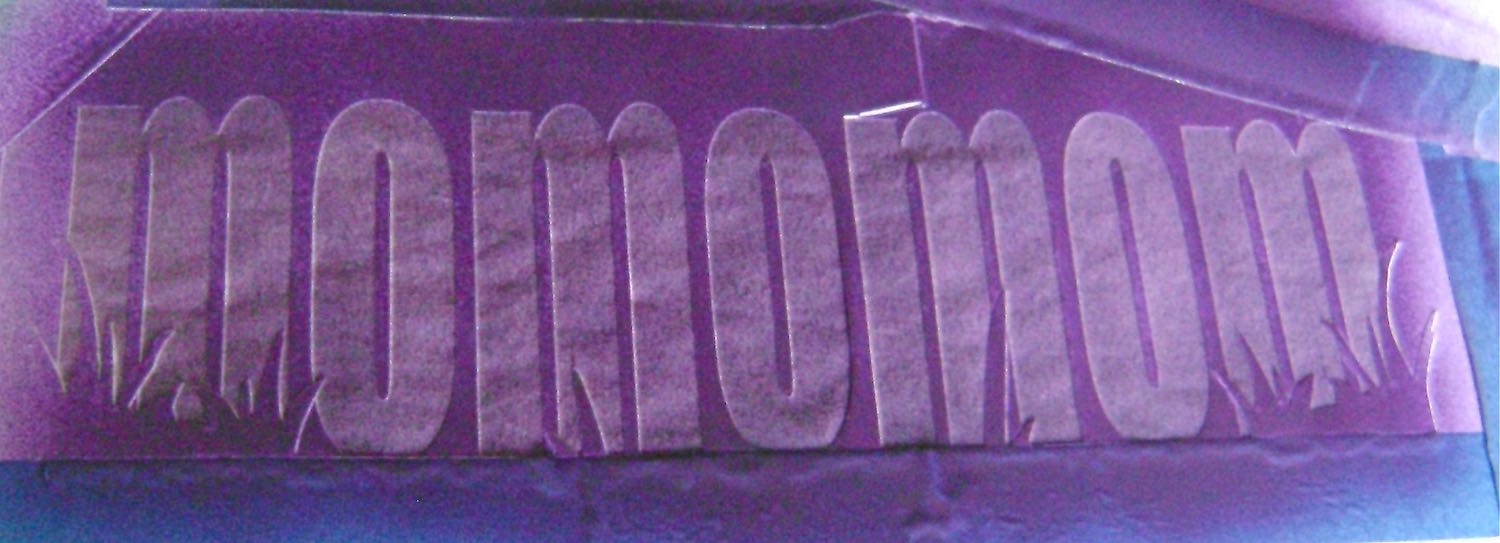 step 6 - Protect areas outside the stencil from over spray and airbrush the open areas with purple paint.