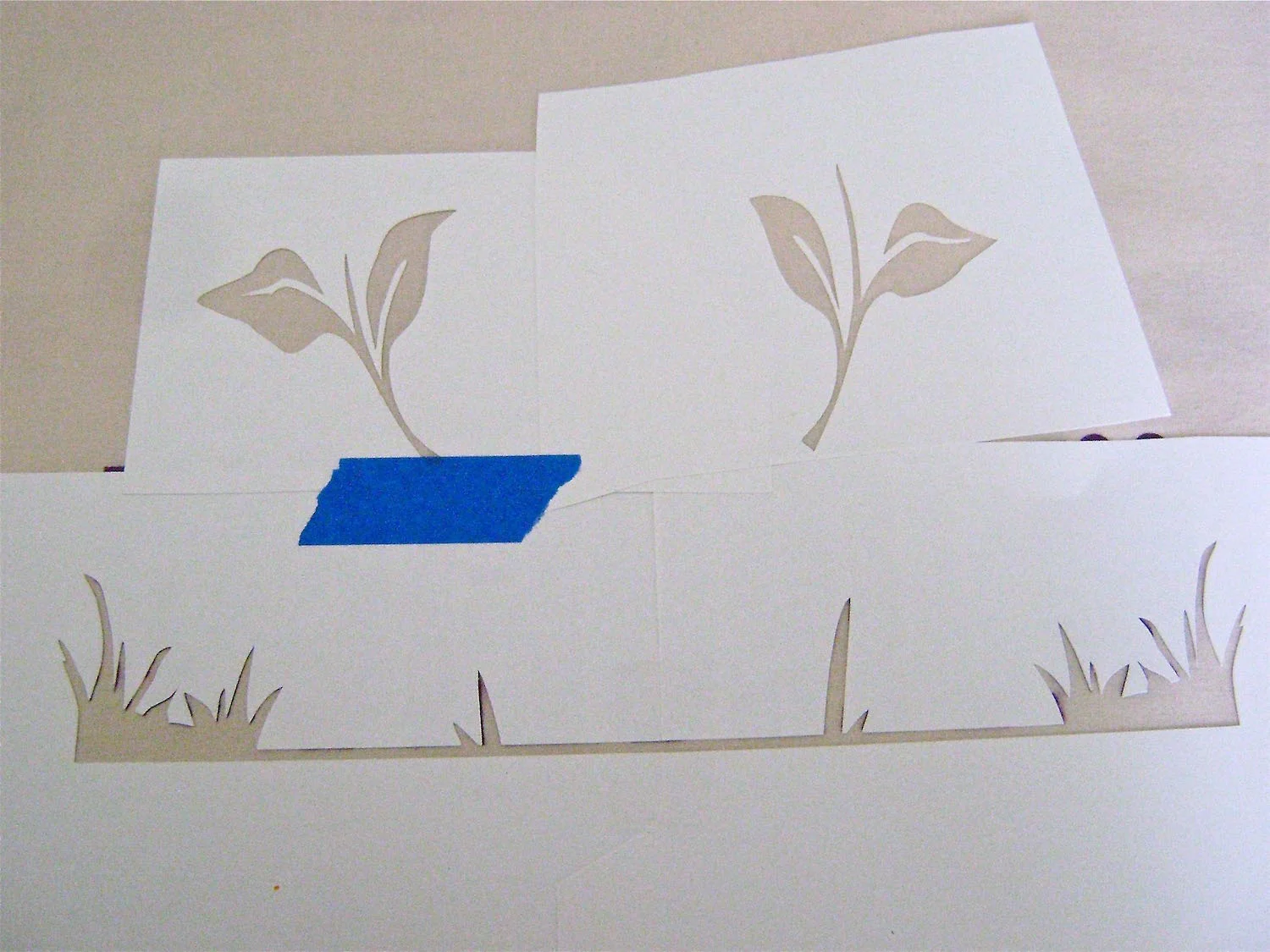 step 9 - Position the leaves above the purple painted lettering.