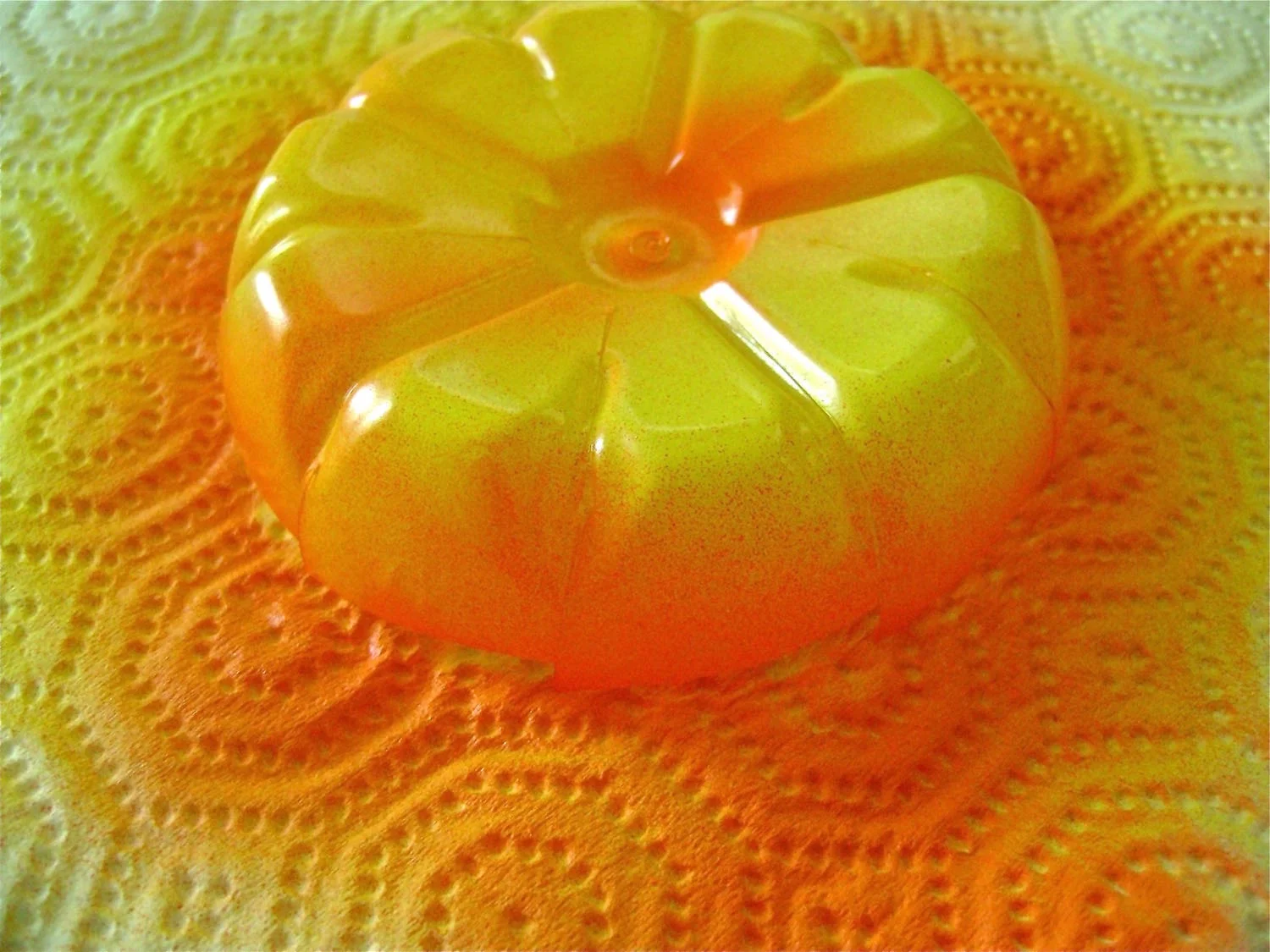 step 3 - Airbrush the outside of the plastic with yellow paint. Add detail by airbrushing a bit of orange to the edges and center. See a complete list of the colors I used below.