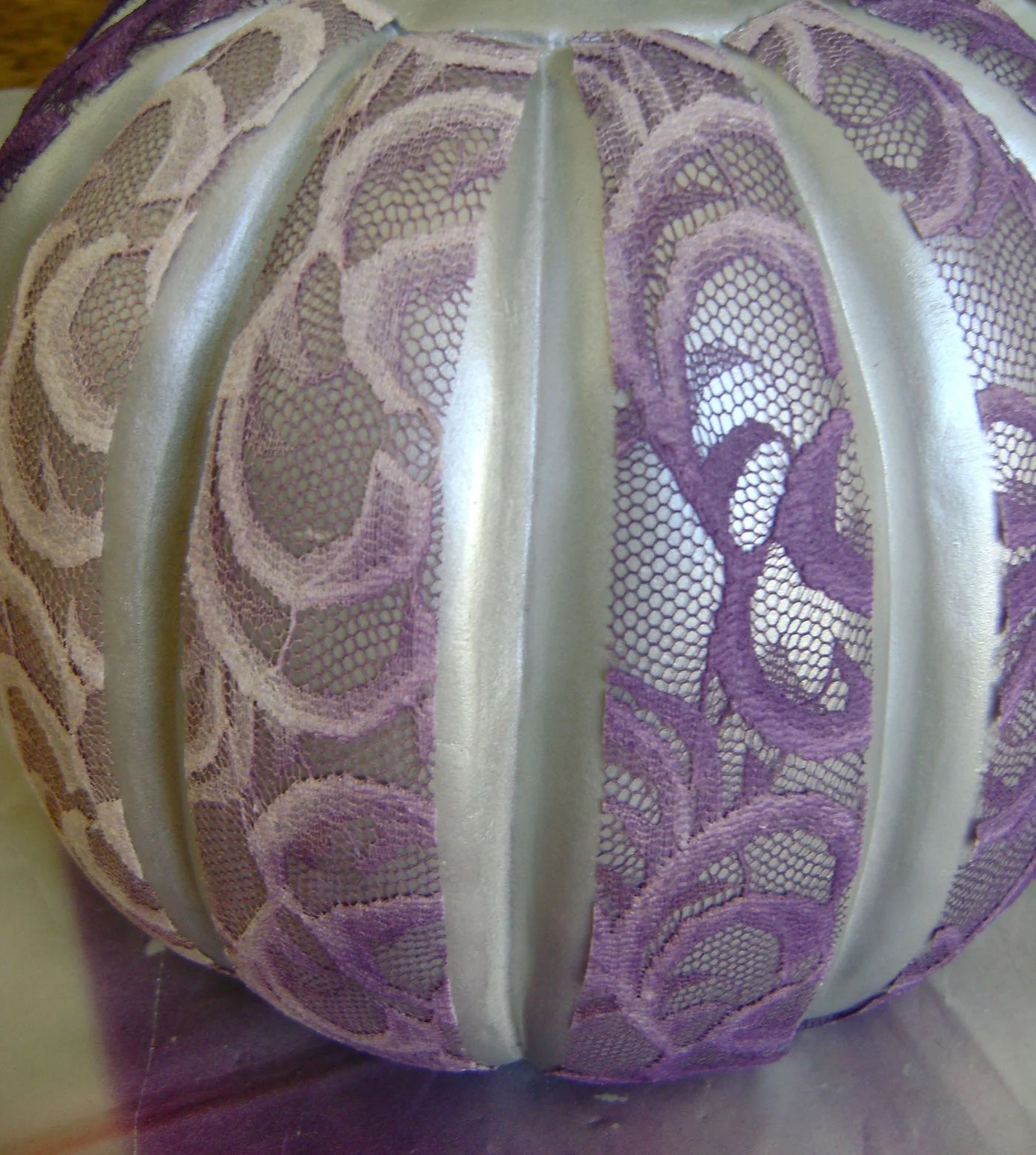 step 5 - Press the 12 pieces onto the pumpkin. Secure the bottom edges on the underside of the pumpkin.