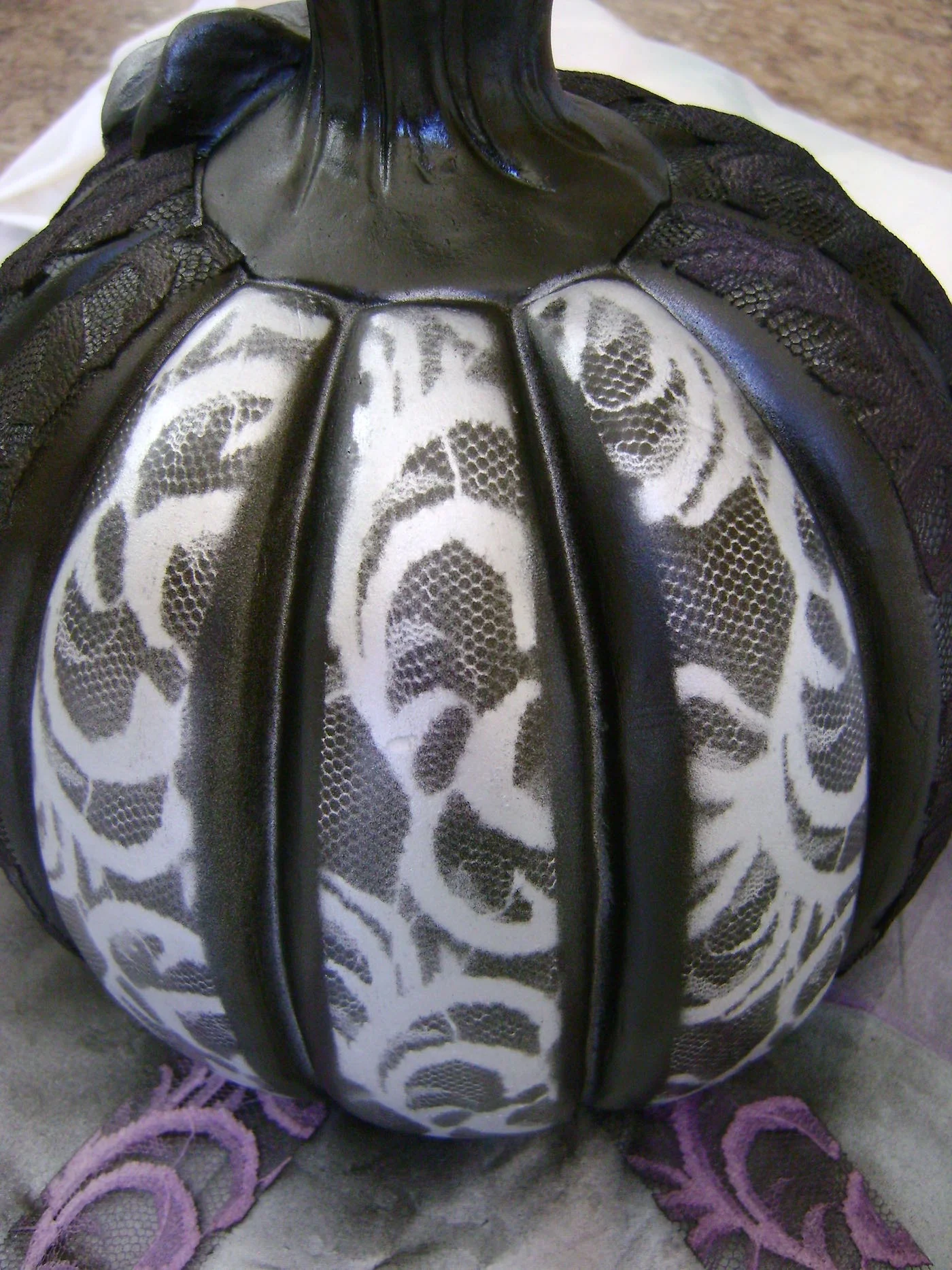 step 9 - When the paint has dried, peel away the lace to reveal the silver design.