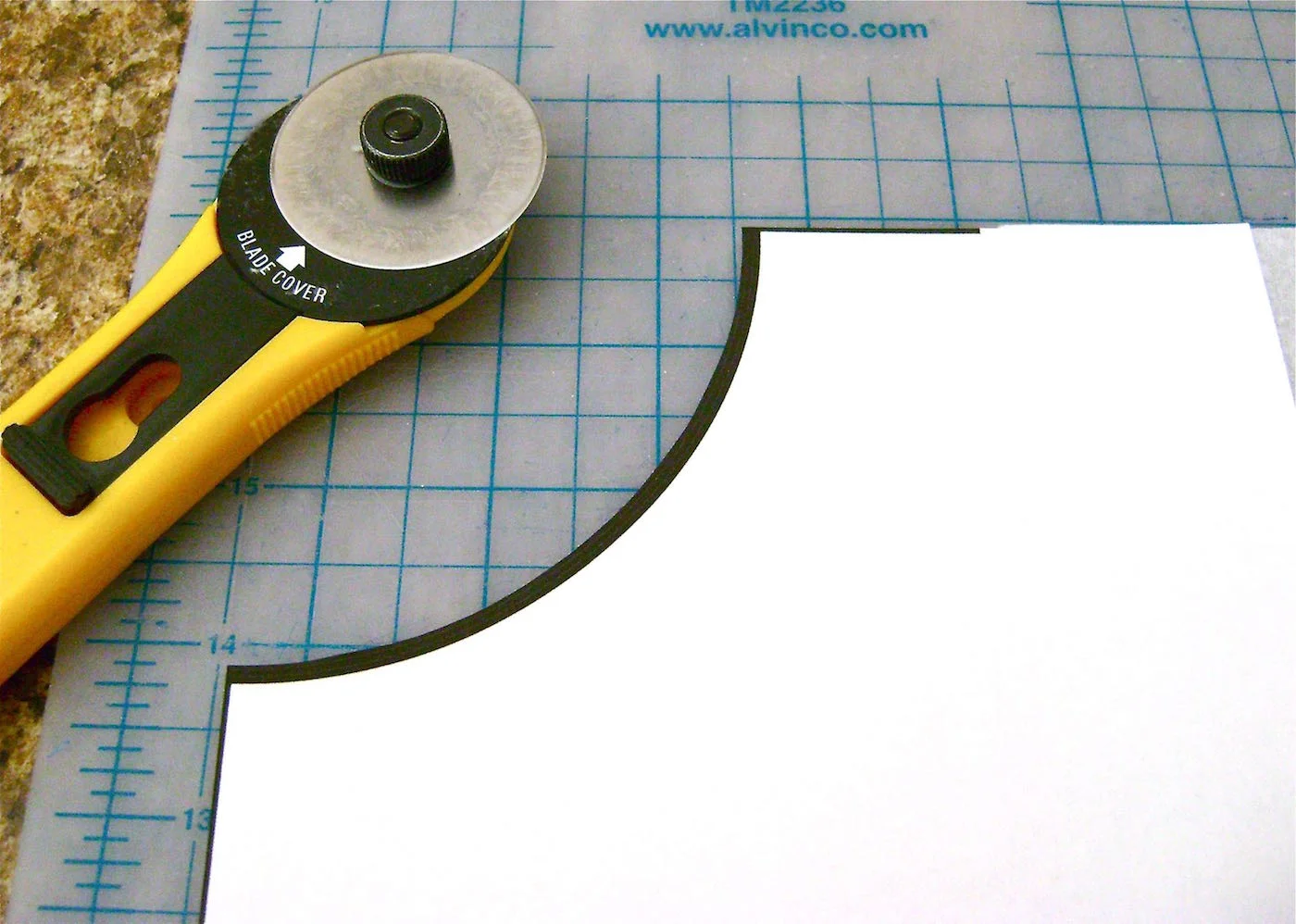 step 3 - Pin in place and cut out the grey area with scissors or a rotary cutter. You now have the curve for the top of the tree skirt.