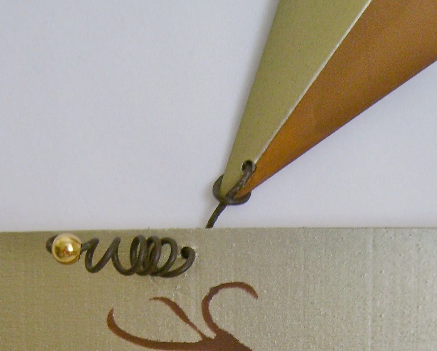 step 14 - Reattach the wires that connect the wood to the metal star. Add a gold bead on each end.