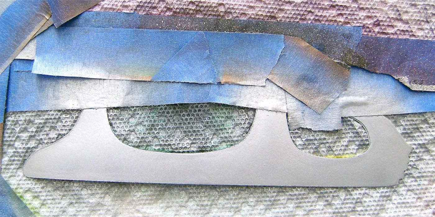 step 2 - Mask all of the skate except the blade. Spray the blade with silver paint. Remove the tape and masking when dry. When masking with tape, be aware that tape applied too firmly may lift the black toner from the printed image.
