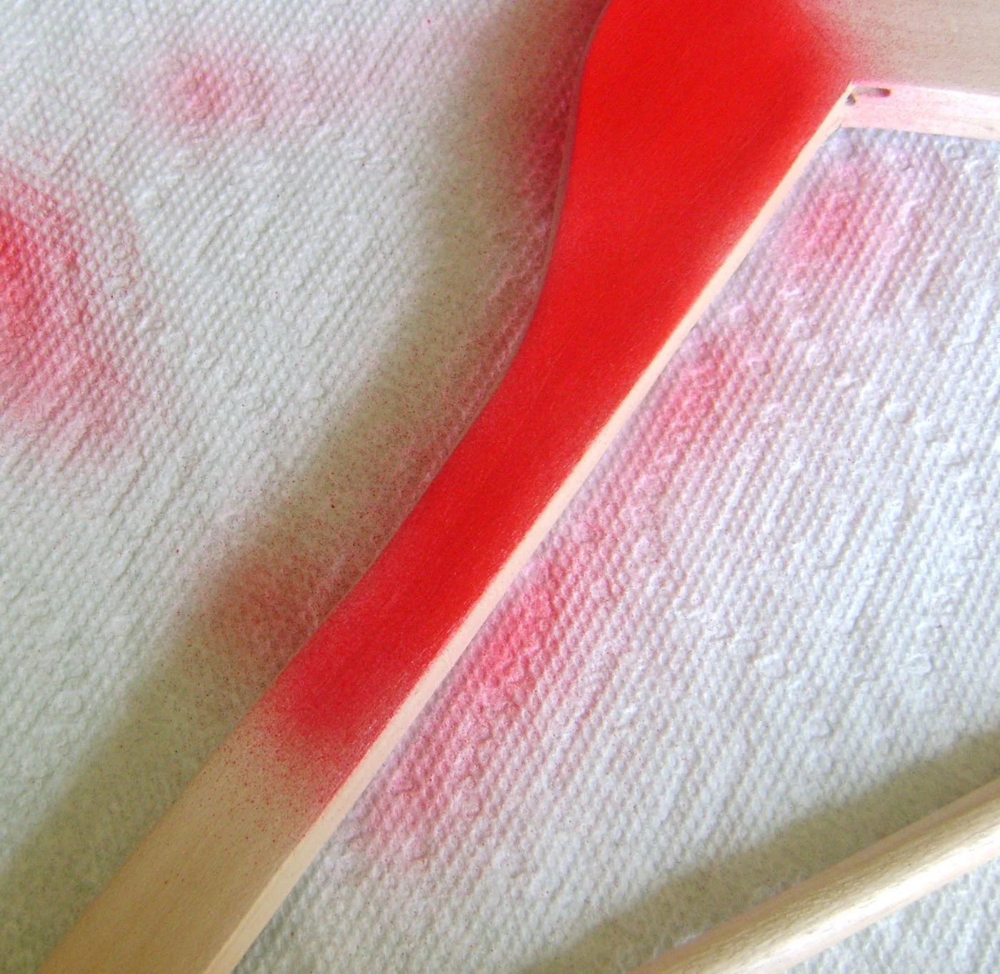step 4 - Airbrush both sides of the wood with red paint. Also paint both sides of the wood heart.