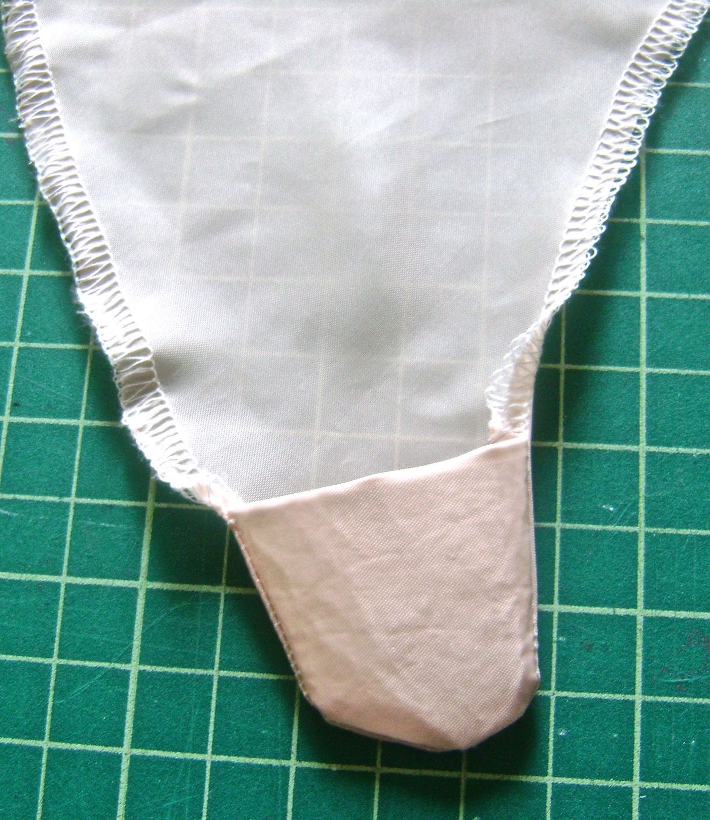 step 5 - Turn fabric facings so the stitching is inside the ends. Iron wrinkles out of fabric.