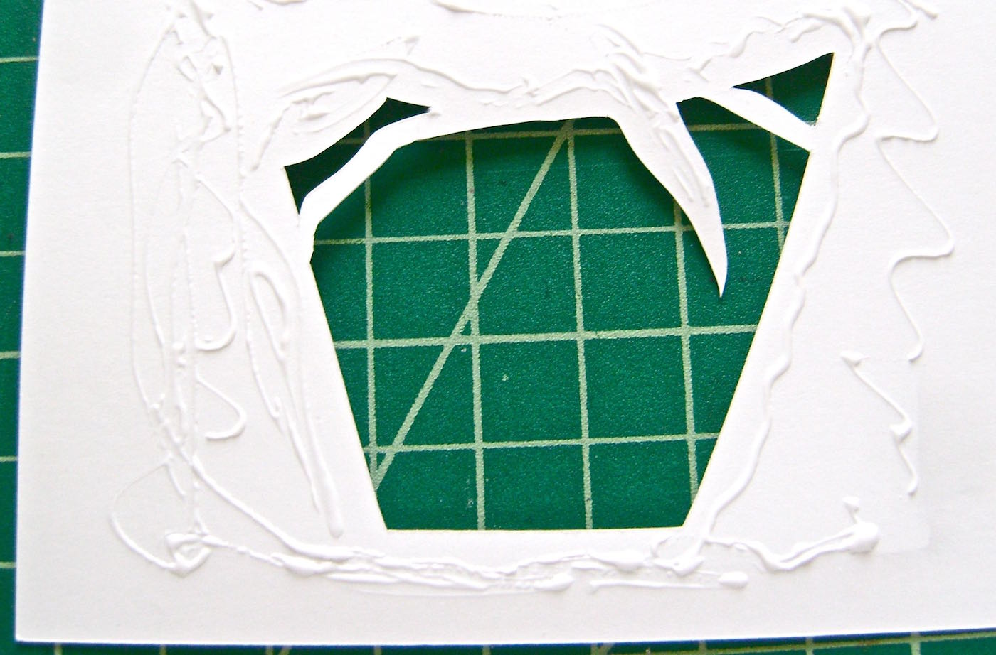 step 3 - Apply Aleene’s Turbo Tacky glue to the wrong side the card front and close to the cut edges. Press the foil to the glue.