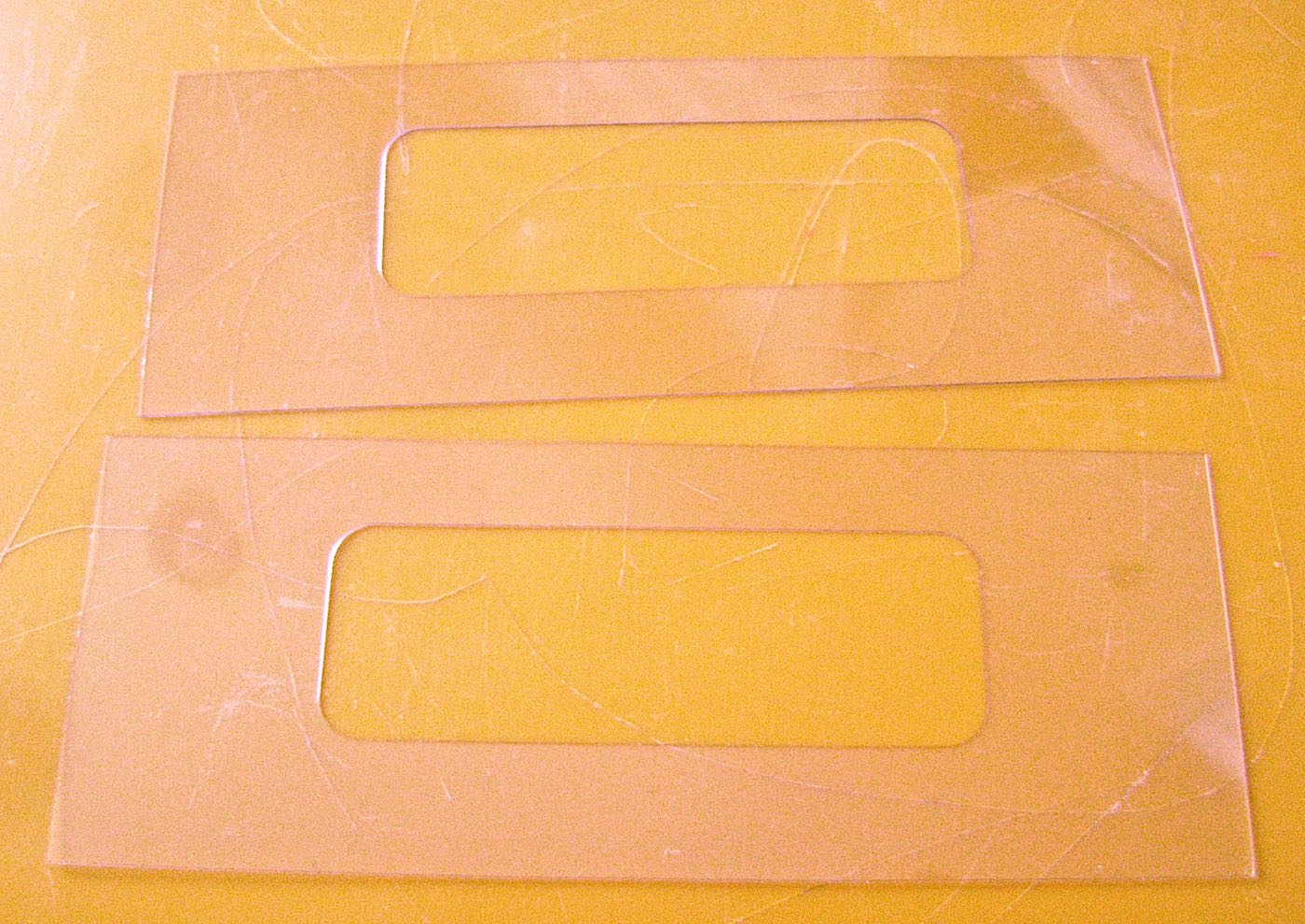 step 9 - While the glue is drying, use the handle support page as a guide to cut out two pieces of clear plastic.