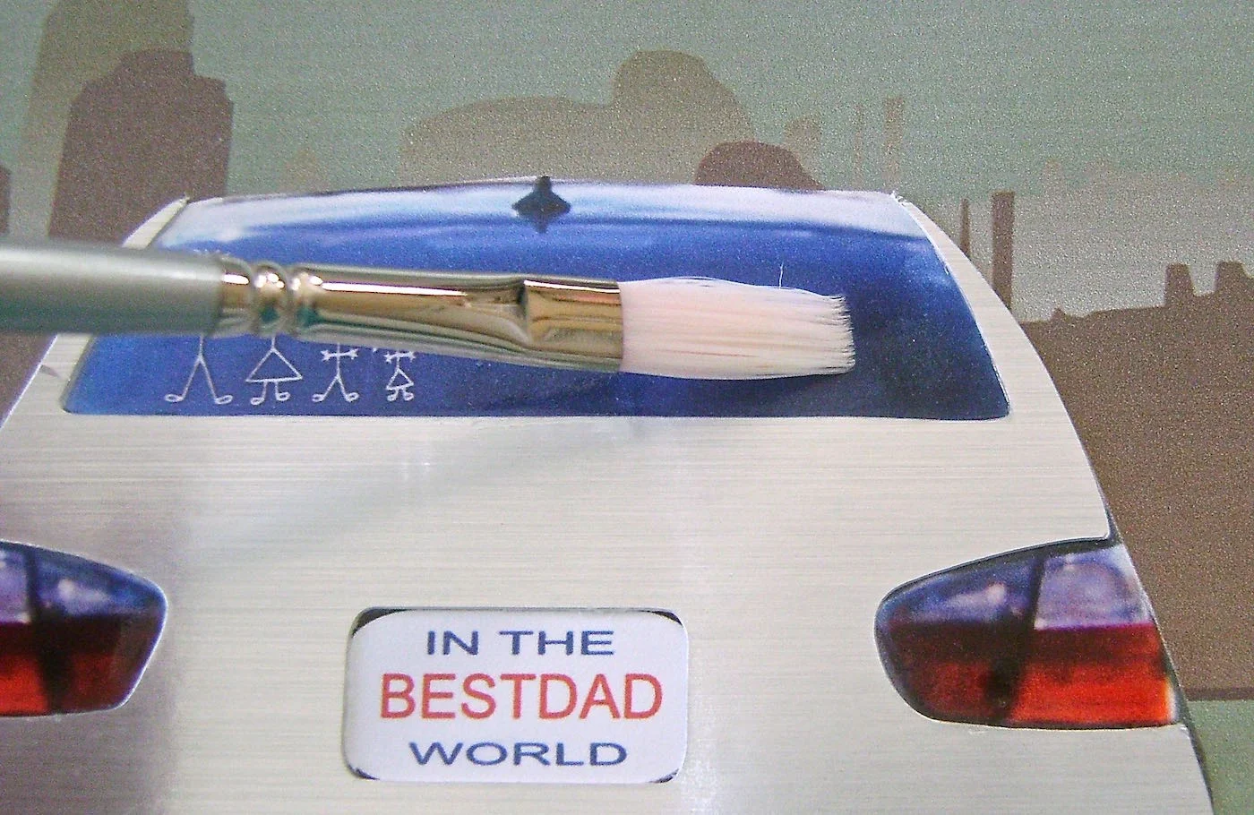 step 5 - Pour the glaze in a small container. With a soft brush generously apply the glaze to the back window and the two tail lights. When the glaze is set, it will be smooth, shiny, and three dimensional.