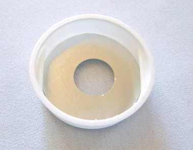 step 10 - Cut a hole in the tube cap. Optional - cut a decorative cover for the hole from metallic card stock.